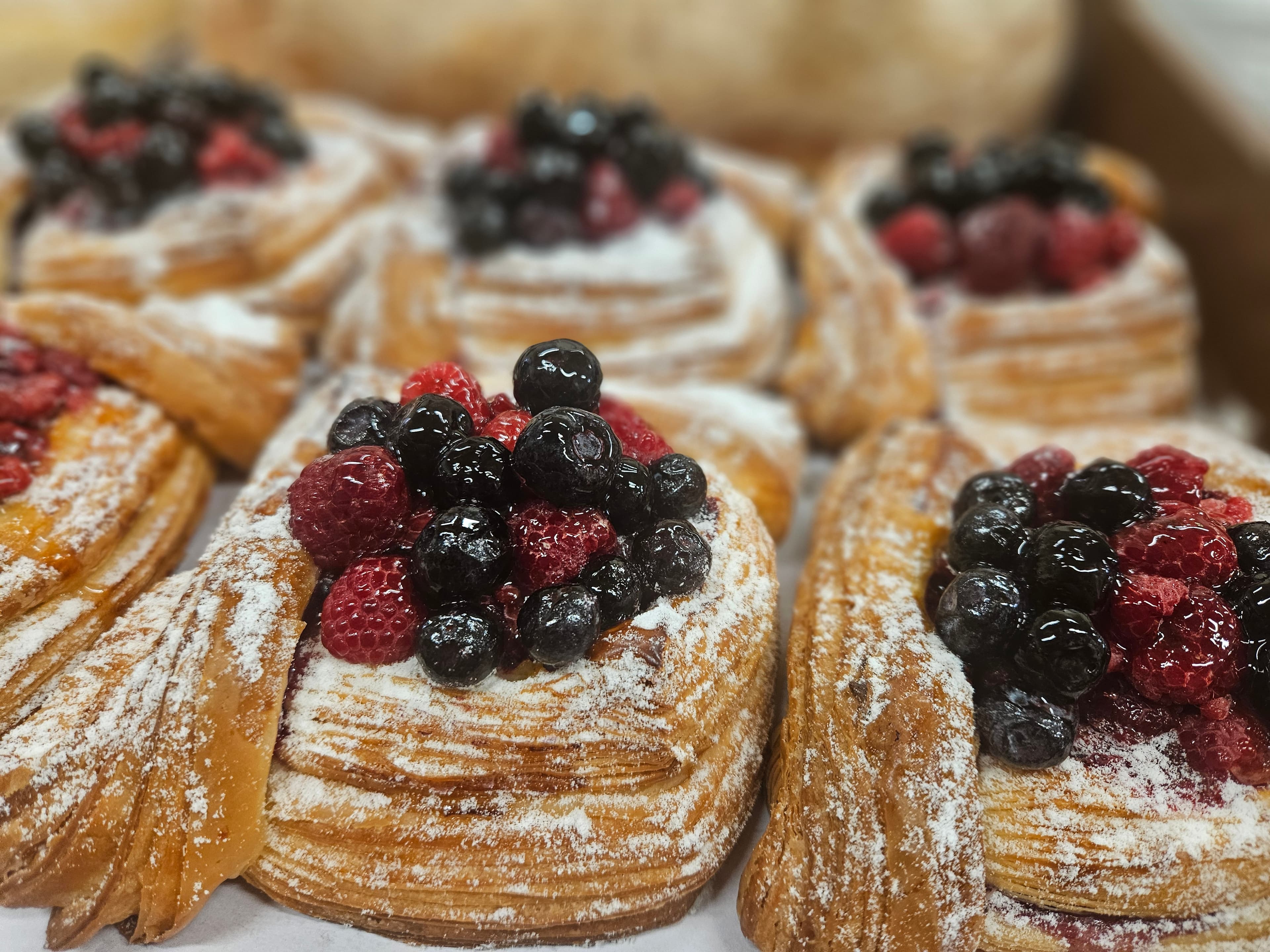 Berry pastries dusted with icing sugar